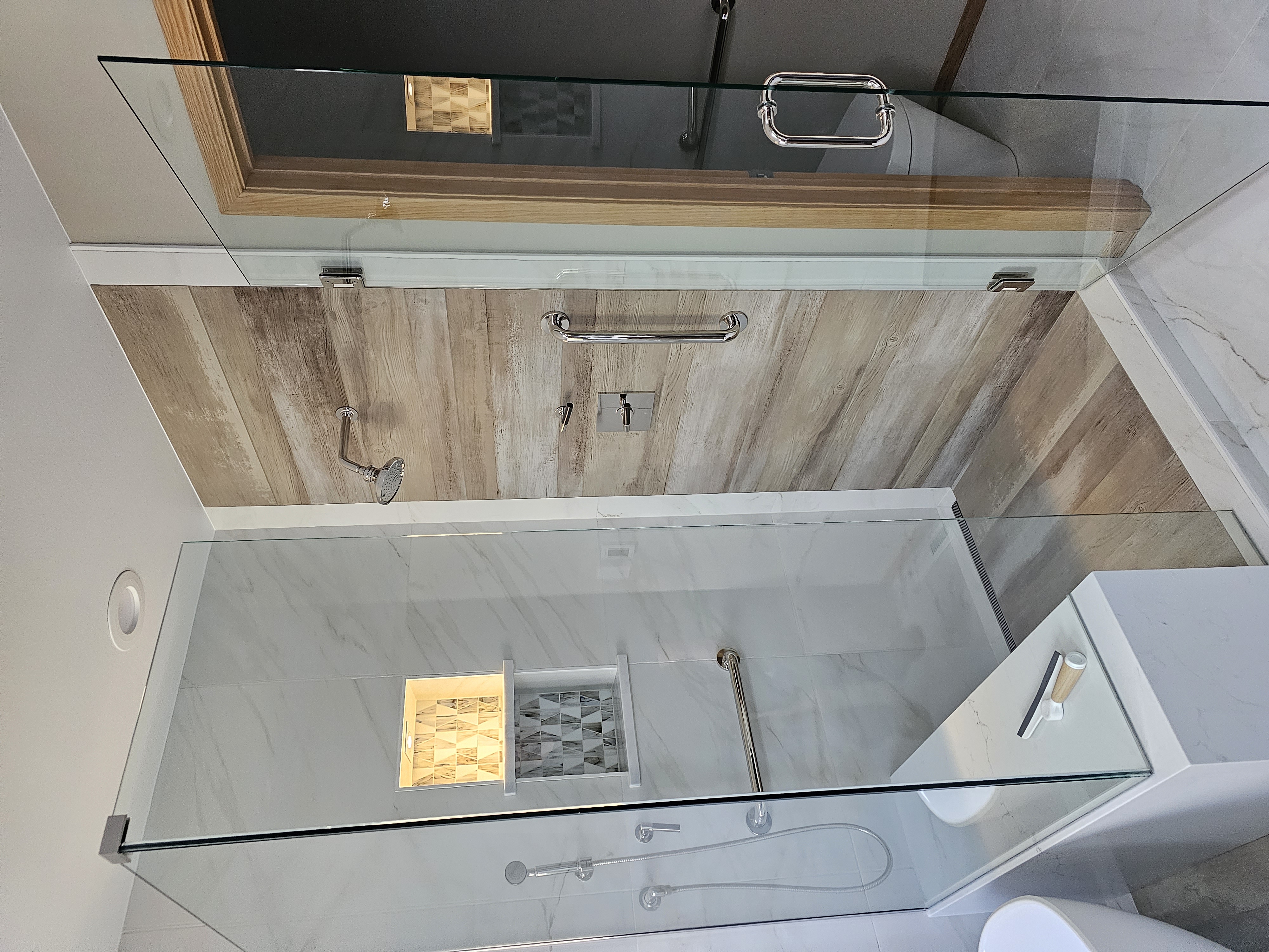 Custom tile shower from a Denver bathroom remodel by Divine Design